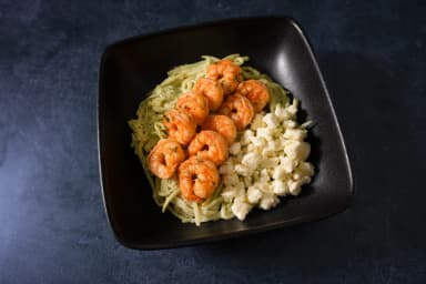 Pasta in cilantro sauce with shrimp