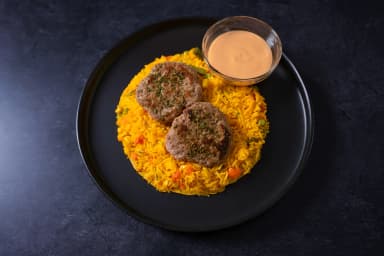 Turkey burger with yellow rice and vegetables