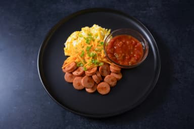 Scrambled eggs with sausage and sauce